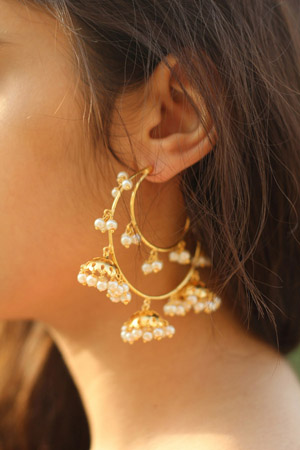 A woman wearing Clip on Earrings 