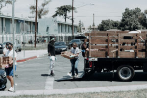 A team of workers loading boxes onto a truck for Junk Removal Jobs